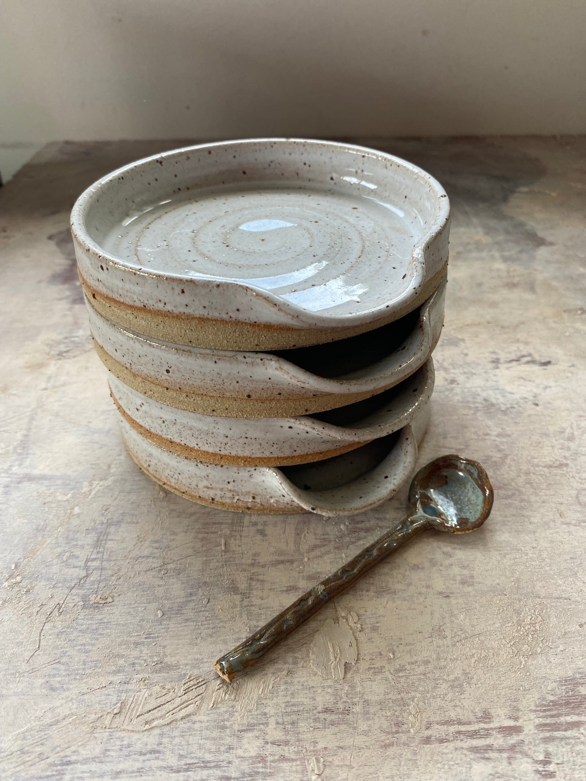 Stack of Irish hand made spoon rests in speckled white